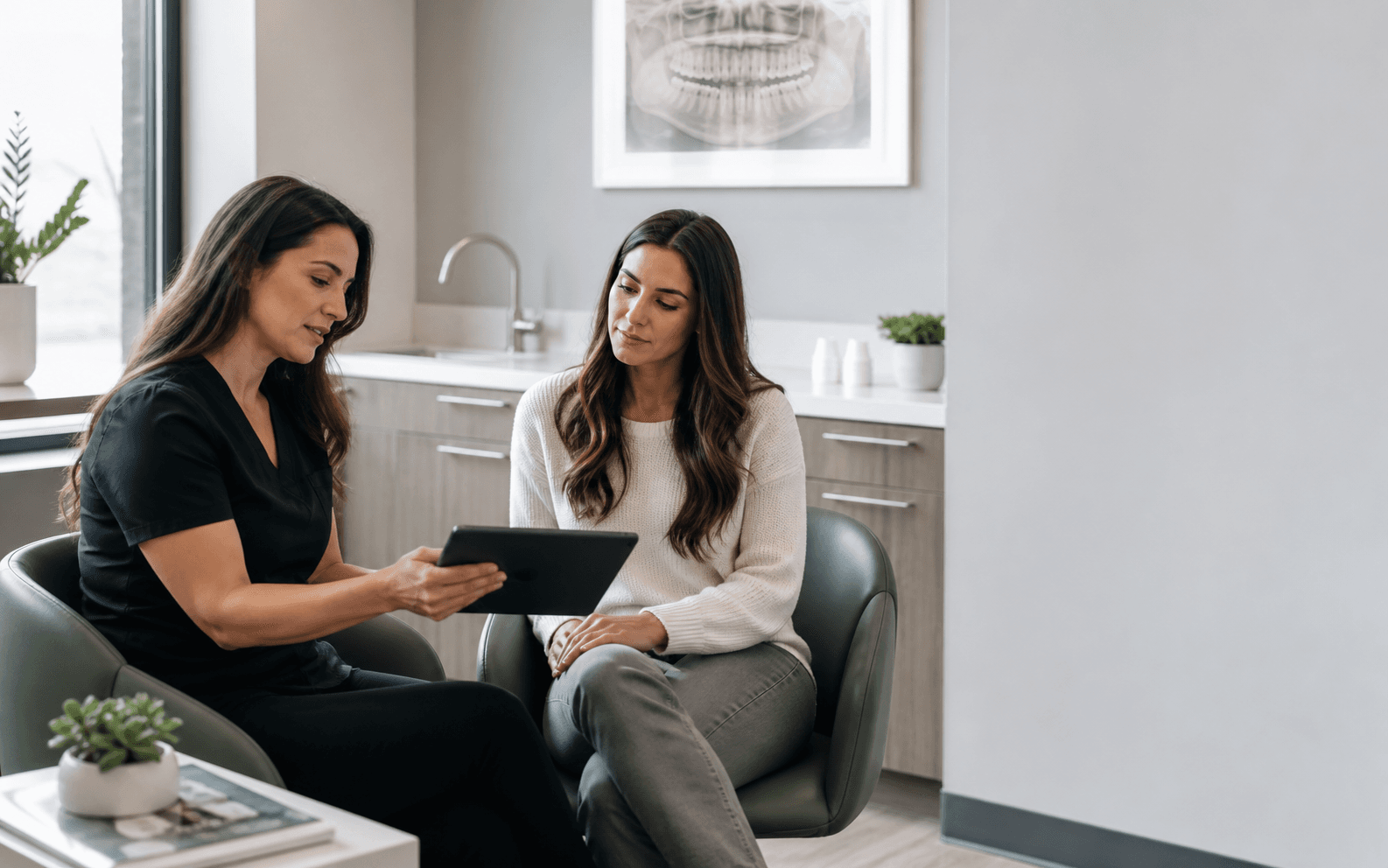 A dental coordinator reviewing a treatment plan with a patient